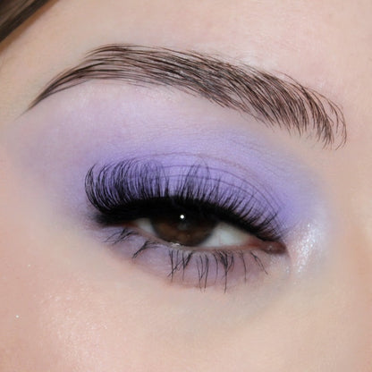 lash swatch of hayati lashes natural volume russian lashes in a cat eye style with a contrasting purple eyeshadow and brown eyes